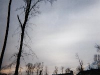 Altostratus clouds are gray or blue-gray mid level clouds composed of ice crystals and water droplets. The clouds usually cover the entire sky. In the thinner areas of the clouds, the sun may be dimly visible as a round disk. Altostratus clouds often form ahead of storms with continuous rain or snow.